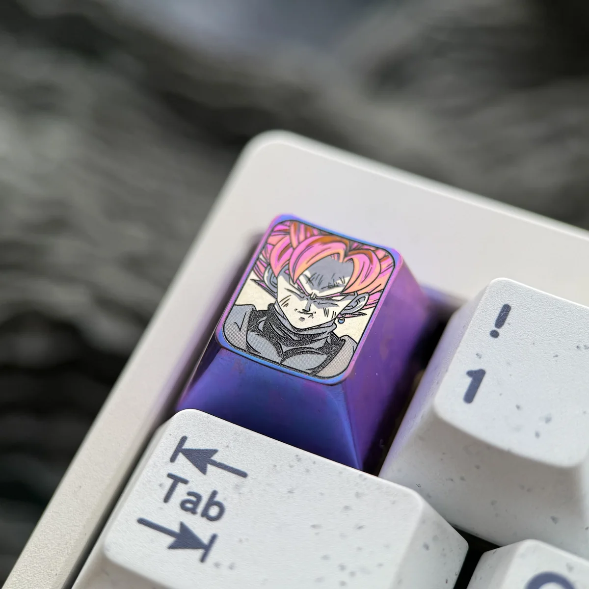 Premium Goku Black Titanium ESC keycap, captured from various angles to highlight its aerospace-grade alloy and vibrant Super Saiyan Rose design.