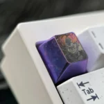 Premium Goku Black Titanium ESC keycap displayed from multiple angles, highlighting its aerospace-grade titanium alloy and vibrant Super Saiyan Rose style.