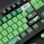 Exclusive DC Green Lantern side-engraved keycaps set in vibrant green and black, showcasing the iconic insignia from multiple artistic angles.
