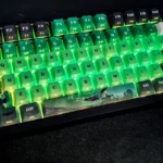 Artistic close-up of exclusive DC Green Lantern side-engraved keycaps set, showcasing the iconic insignia in vibrant green and black from a heroic angle.