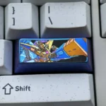 A vibrant anodized Gundam Titanium Keycap, showcasing its intricate mecha design and premium titanium alloy from multiple angles.