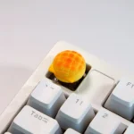Whimsical handcrafted artisan keycaps, a gallery of delectable miniature baked desserts. Multiple angles showcase their intricate details and premium design.