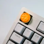 A collection of whimsical handcrafted artisan keycaps, each a realistic miniature baked dessert, showcasing delectable sweet treats from various delightful setup.