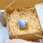 Whimsical Handcrafted 3D Artisan Parrot Hugging Stump Keycap showcasing its intricate parrot, vibrant peony, and wooden stump from various angles.