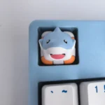 A collection of handcrafted resin animal artisan keycaps from various angles, showcasing whimsical designs and vibrant details that add playful charm.