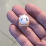 Handcrafted resin animal artisan keycap gallery, showcasing whimsical designs and vibrant, detailed resin from various angles, emphasizing unique artisan.