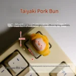 Adorable handmade 3D pig keycap, custom sculpted into a whimsical taiyaki piggy bun, featuring a charming dessert-inspired design.