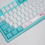 Artistic product shots of Hatsune Miku keycap set, revealing their radiant 4-sided translucent glow and vibrant character details from various perspective angles.