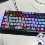 Close-up of Hatsune Miku Rabbit Hole translucent keycaps set, revealing their vibrant anime-inspired details and ethereal glow from various angles.