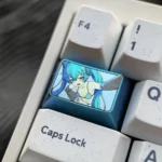 Detailed views of the exclusive Hatsune Miku titanium artisan keycap, showcasing its vibrant anime art and polished finish from various angles.