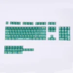 Experience the vibrant tropical Hawaiian PC dye-sub keycaps from multiple angles, highlighting their premium translucent glow and lush light green design.