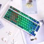 Vibrant tropical Hawaiian PC dye-sub keycaps set, translucent and glowing with lush green, displayed from various angles. A playful premium paradise design.