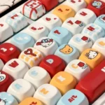 Playful Hello KittA collection of Hello Kitty MOA profile keycaps set from different angles, highlighting the vibrant character art and smooth, ergonomic design.y MOA profile keycap set photos, displaying iconic character art, smooth pastel aesthetic, and its unique shape from different angles.