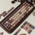 Whimsical Hello Kitty Mont Blanc keycaps set showcase a delightful cat head design in rich chestnut and creamy white hues, part of the exclusive dessert-inspired.