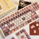 Exclusive Hello Kitty Mont Blanc keycaps set featuring warm chestnut and creamy white dessert swirls, a delightful 147-key set for a cozy keyboard.