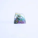 Intricately hand-painted Sherma translucent artisan Hollow Knight keycap, glowing with its unique profile from various angles.