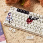A playful gallery view of the Charming JK Girl PBT Anime Keycaps Set, showcasing various original custom keycaps with Japanese schoolgirl art from multiple angles.