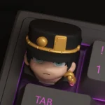 Artistic Jotaro Kujo Jojo keycap displayed from a unique angle, showcasing its vibrant anime character design and 3D printed texture. An iconic Jojo's design.