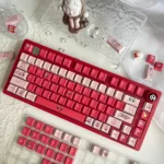 Playful Kirby PBT dye-sub keycaps set arranged from a charming new angle, revealing the vibrant, iconic character art and smooth premium PBT finish.