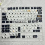 Close-up views of the whimsical Klein Moretti Cat Keycaps Set from the LoM Feline Set, showcasing the exclusive chibi-style Lord of Mysteries design from various angles.