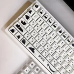 Opaque Klein Moretti cat keycaps set crafted from premium PBT, showcasing minimalist feline artistry for a striking, modern keyboard aesthetic.