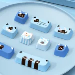 Whimsical Lazy Cat Keycap Set in MAO profile, showcasing its adorable cartoon design and durable PBT material from multiple charming angles.