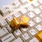 Handcrafted whimsical lemon toast cake artisan keycap from various angles, showcasing its charming miniature design and intricate, edible-looking keyboard.