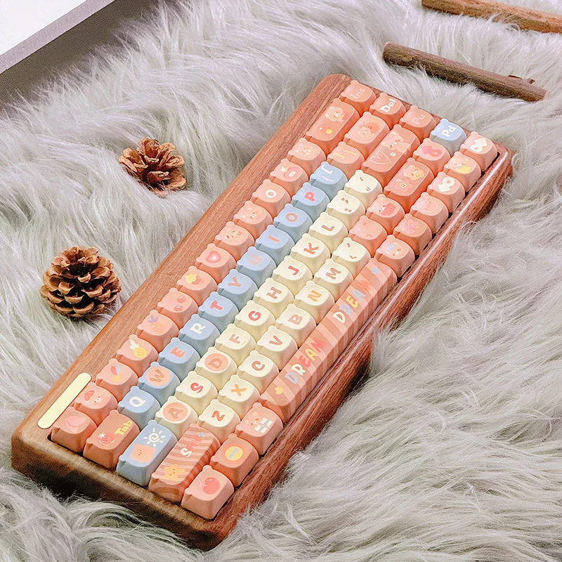 Close-up of charming Maillard Bear PBT dye-sub keycaps set from various angles, showcasing the warm caramel and brown illustrations for a cozy, playful keycap.