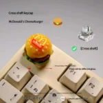 This playful and iconic cheeseburger keyboard knob showcases a vibrant, miniature 3D design with detailed craftsmanship.