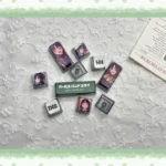 Subaru Awa MDA Keycaps Set in a gallery view, highlighting their sleek, ergonomic MDA profile and artistic four-sided translucent RGB lighting from multiple angles.