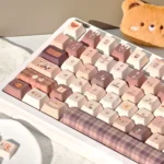 Close-up of the adorable Meow Cafe PBT Dye-Sub Keycap Set from a side angle, revealing charming pastel feline designs and premium texture.