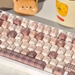 Detailed shot of the adorable Meow Cafe PBT Dye-Sub Keycap Set, showcasing premium PBT dye-sublimated keys with charming feline characters and a warm pallete.
