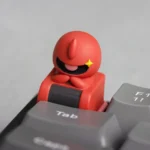 A gallery of handcrafted Chibi Character resin keycaps, showing vibrant stylized mecha art from various artistic angles.