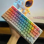 Vibrant Mondrian Themed MOA Keycap Set displayed from a dynamic angle, highlighting the smooth PBT texture and energetic gradient color transitions.