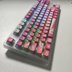 Dynamic MyGO Chihaya Anon glowing PBT keycaps set from multiple views, highlighting their all-sided translucent glow and playful anime art.