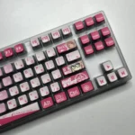 Exclusive MyGO Chihaya Anon glowing PBT keycaps set, translucent and vibrant with dynamic anime art, shown from multiple playful angles.