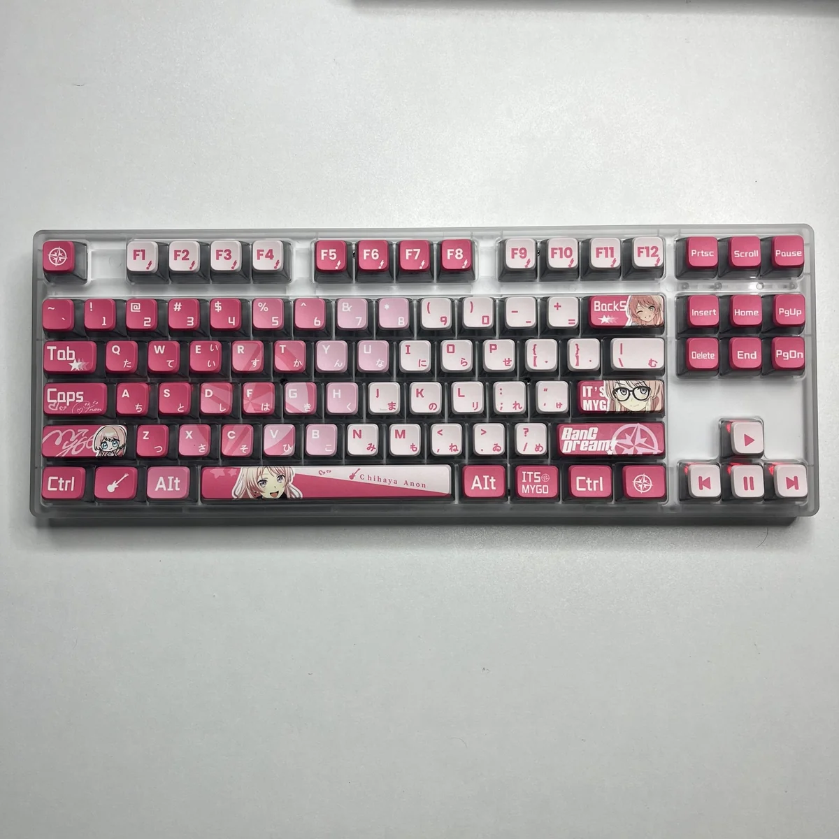 MyGO Chihaya Anon glowing PBT keycaps set, an exclusive translucent set featuring dynamic anime art and a radiant glow.