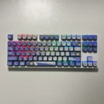 MyGO Tomori translucent PBT keycaps set, shown from an artistic angle, revealing its four-sided glow and vibrant anime design, enhancing an RGB setup.