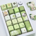 Dynamic shot of the exclusive Genshin Impact Nahida MDA profile keycaps set, revealing their vibrant character art and whimsical details from a distinct angles.