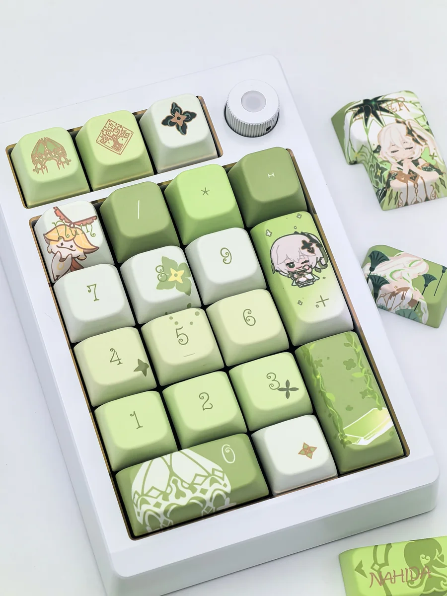 Dynamic shot of the exclusive Genshin Impact Nahida MDA profile keycaps set, revealing their vibrant character art and whimsical details from a distinct angles.