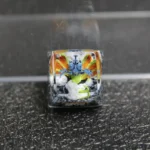 Close-up views of the handcrafted Chomei's Spirit Naruto artisan resin keycap, revealing its vibrant Tailed Beast sculpture and intricate details.