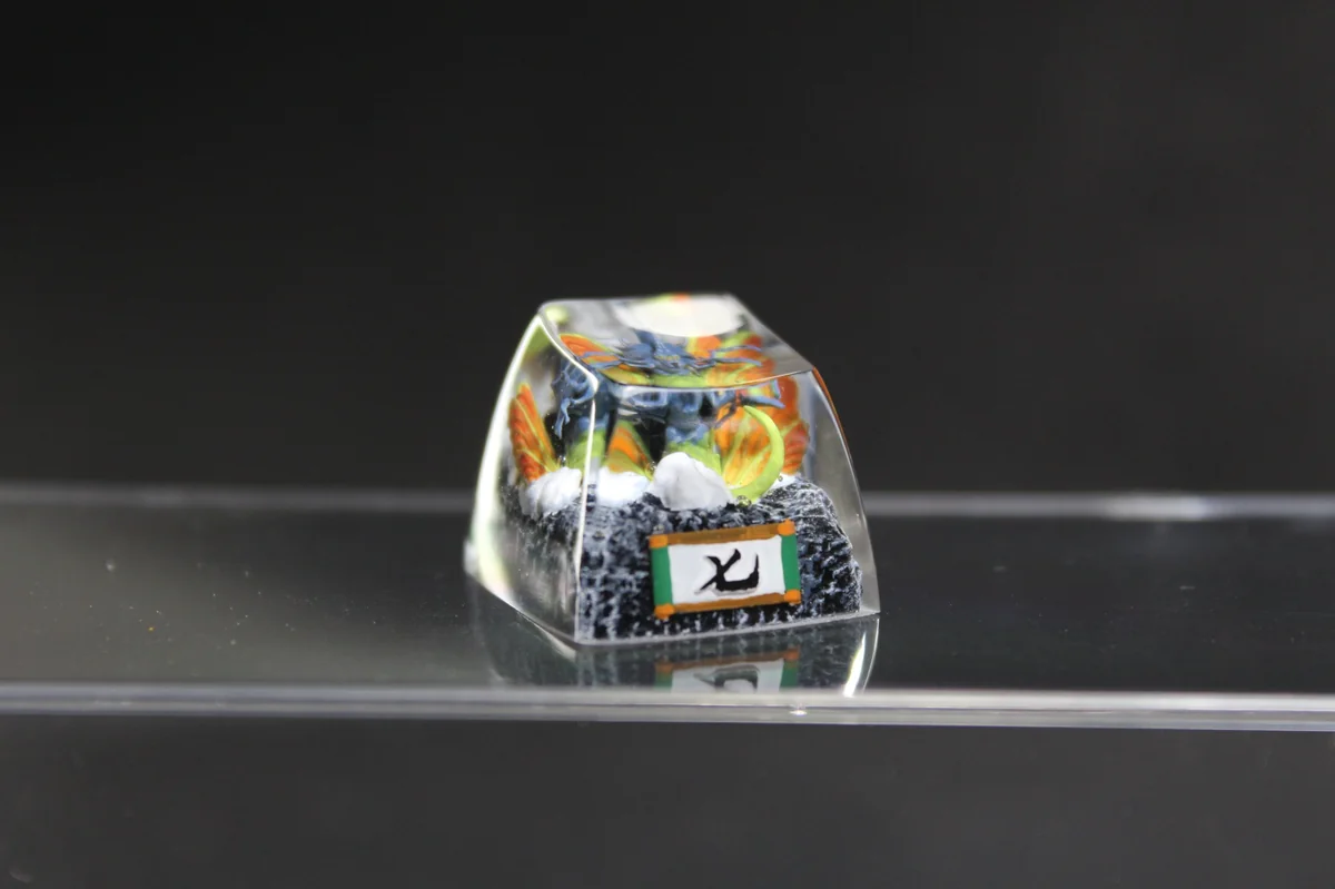 Vibrant, handcrafted Naruto artisan resin keycap featuring the intricate sculpture of Chomei, the Seven-Tails, a unique collectible.
