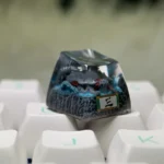 Multiple angles of the handcrafted Naruto Isobu Tailed Beast resin keycap, highlighting its ethereal aquatic design and vibrant sky-blue artistry.