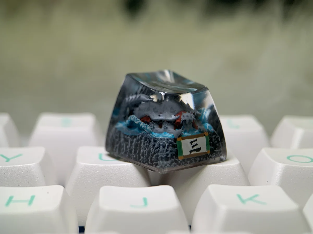 Multiple angles of the handcrafted Naruto Isobu Tailed Beast resin keycap, highlighting its ethereal aquatic design and vibrant sky-blue artistry.