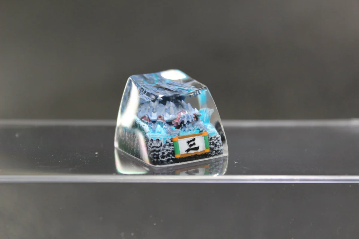Artistic handcrafted Naruto Isobu Keycap showcasing an ethereal sky-blue Tailed Beast within intricate resin art.