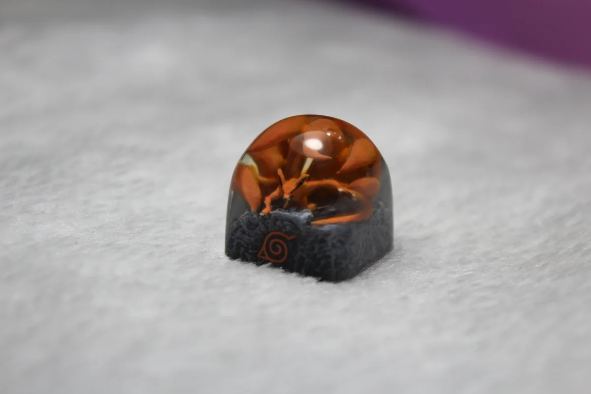 Exquisite handcrafted Naruto Kurama artisan keycap showcasing the dynamic Nine-Tails in fierce anime power art.
