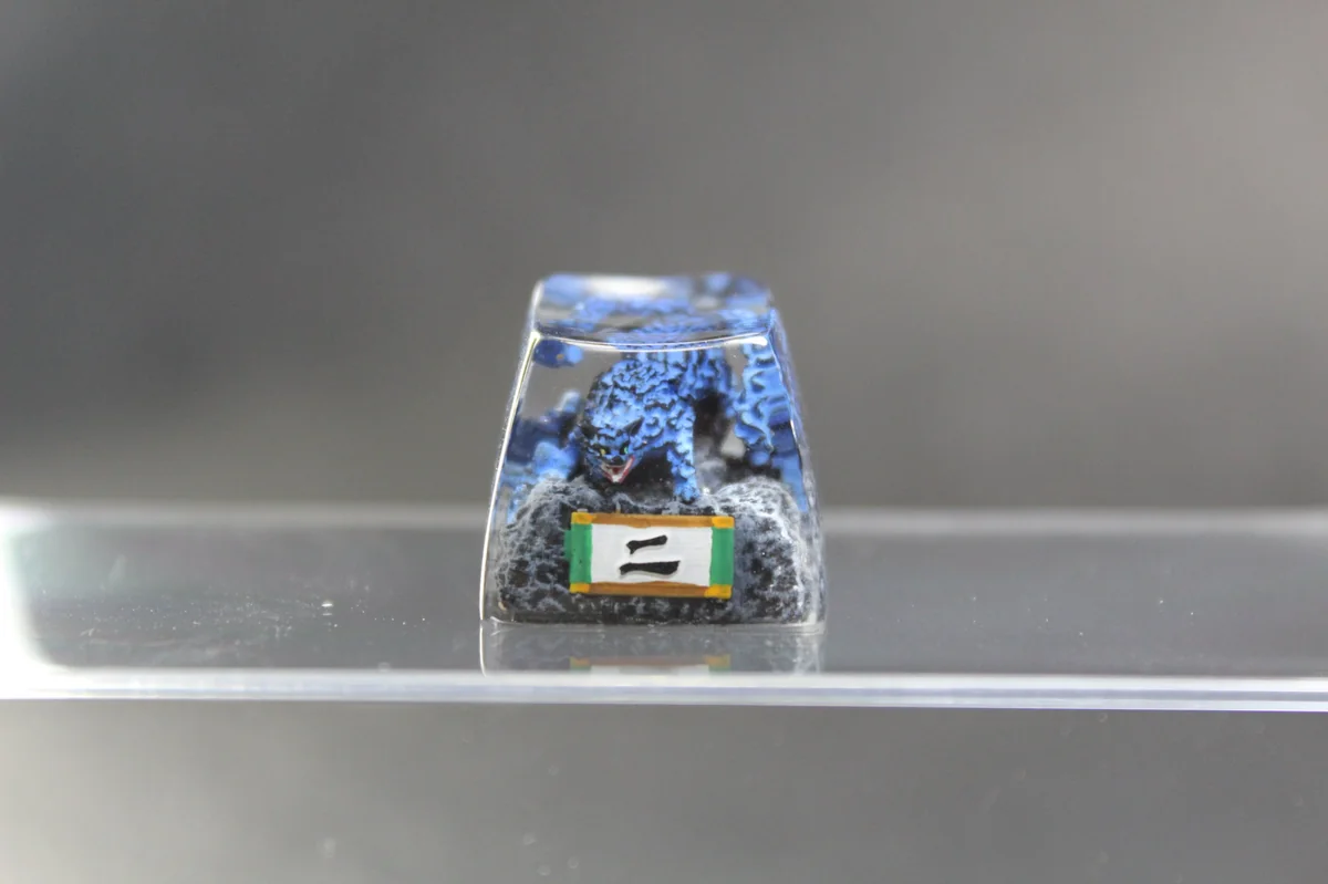 Handcrafted Naruto Matatabi artisan keycap, an artistic view of the fiery Two-Tails feline with glowing blue flames and intricate resin sculpture.