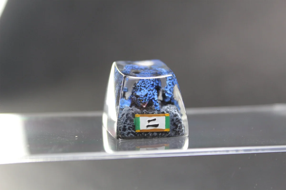 Handcrafted Naruto Matatabi artisan keycap featuring a fiery mythical feline with glowing blue flames, intricately sculpted in resin.