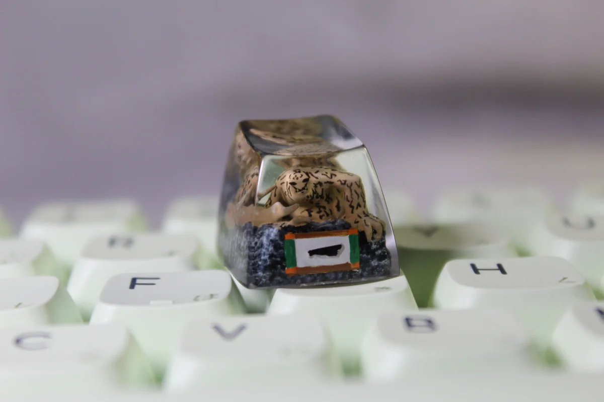 Close-up of a premium handcrafted white resin Naruto Shukaku artisan keycap, intricately sculpted with anime-inspired detail.