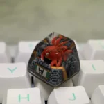 Vibrant red handcrafted Naruto Four-Tails resin keycap showcasing intricate details and a powerful anime aesthetic.